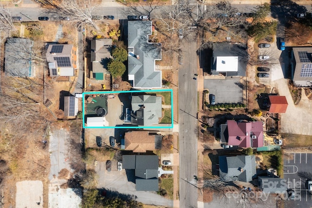 birds eye view of property with a residential view