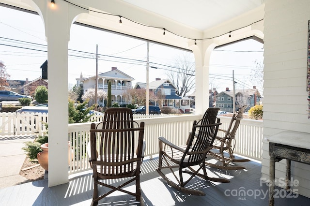 view of patio featuring a residential view and covered porch