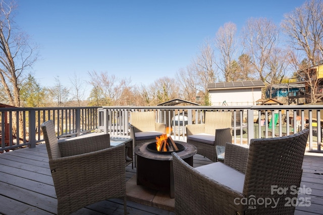 deck with a fire pit