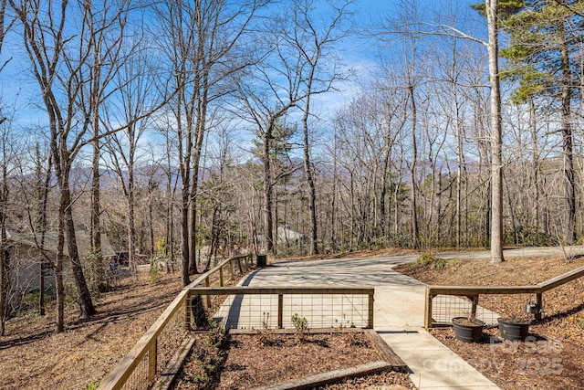 view of home's community with a forest view