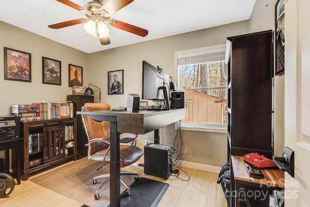 home office with ceiling fan, baseboards, and wood finished floors