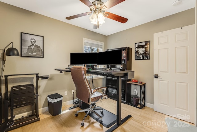 office with a ceiling fan, wood finished floors, and baseboards