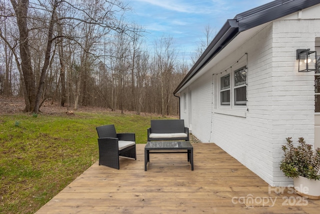 wooden terrace with a lawn