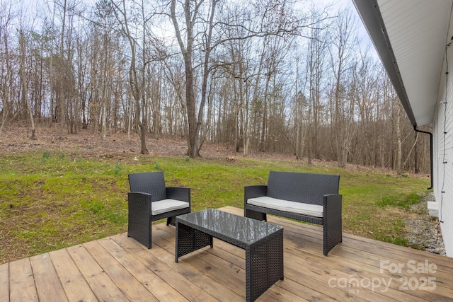 deck featuring a lawn and outdoor lounge area