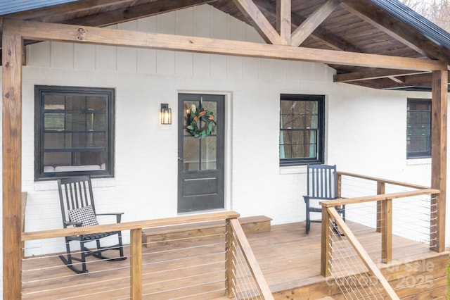 doorway to property with brick siding