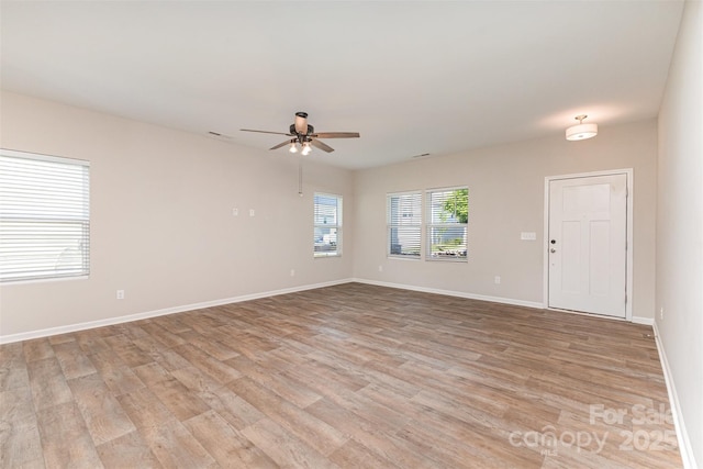 1120 Freeman View Dr, Albemarle, NC 28001 - unfurnished room featuring ceiling fan, light wood finished floors, and baseboards