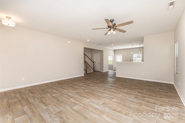 1120 Freeman View Dr, Albemarle, NC 28001 - unfurnished living room with light wood-type flooring, ceiling fan, baseboards, and recessed lighting
