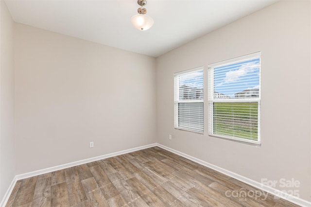 1120 Freeman View Dr, Albemarle, NC 28001 - unfurnished room featuring baseboards and wood finished floors