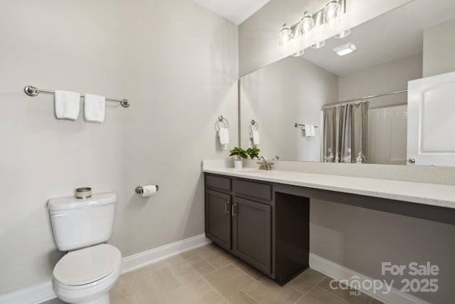 8310 Sandstone Crest Ln, Indian Land, SC 29707 - full bathroom with tile patterned flooring, baseboards, vanity, toilet, and a shower with shower curtain