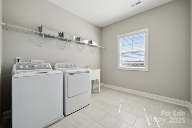8310 Sandstone Crest Ln, Indian Land, SC 29707 - clothes washing area featuring laundry area, visible vents, light tile patterned flooring, baseboards, and separate washer and dryer