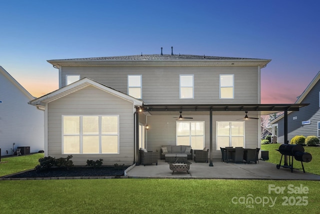 8310 Sandstone Crest Ln, Indian Land, SC 29707 - back of property with a lawn, an outdoor living space, and a ceiling fan