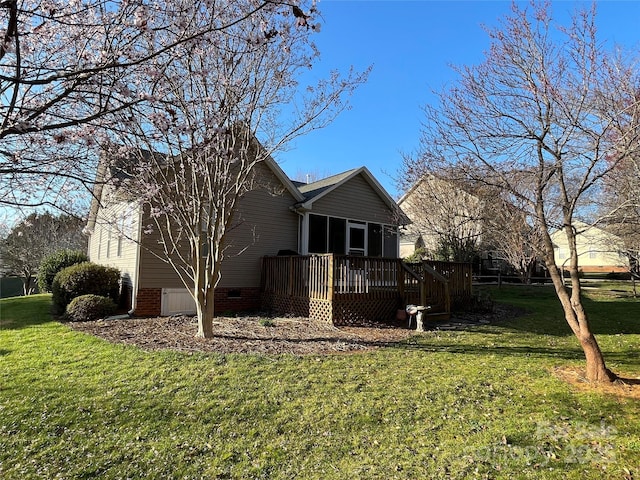 view of home's exterior featuring crawl space, a yard, and a deck