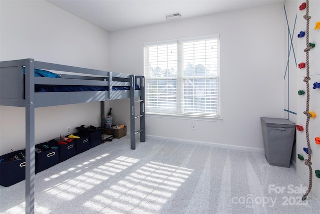 bedroom featuring baseboards, visible vents, and carpet floors