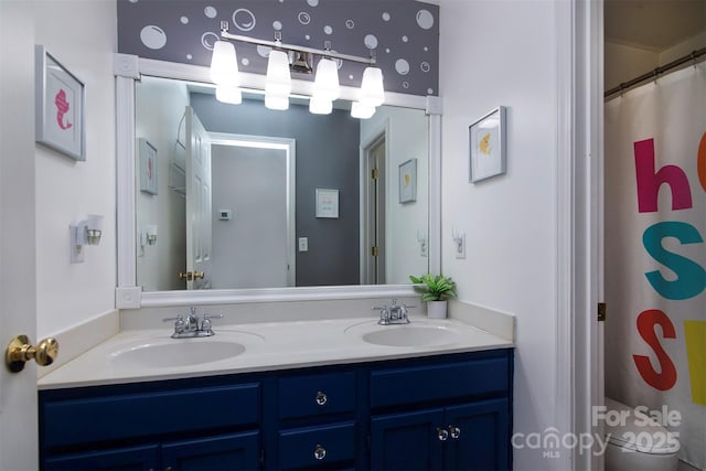 bathroom with double vanity and a sink