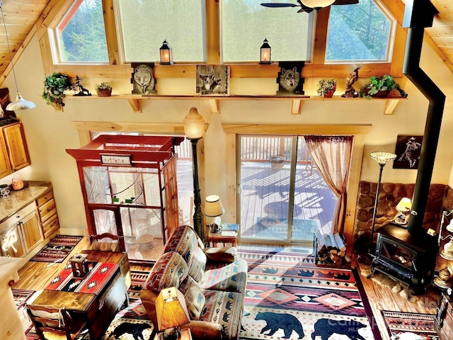 6033 Low Country Rd, Lenoir, NC 28645 - living area featuring a ceiling fan, a wealth of natural light, and a wood stove