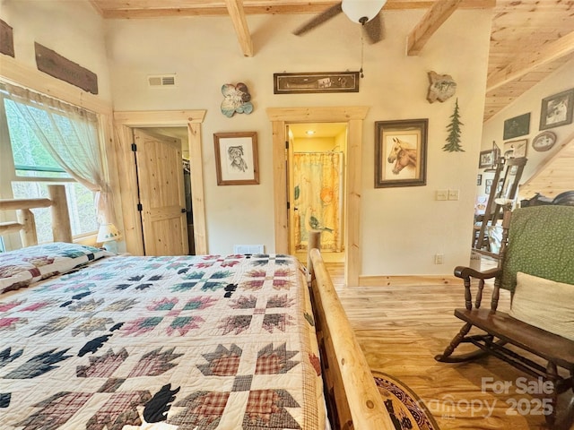 6033 Low Country Rd, Lenoir, NC 28645 - bedroom with lofted ceiling with beams, baseboards, ensuite bath, visible vents, and wood finished floors