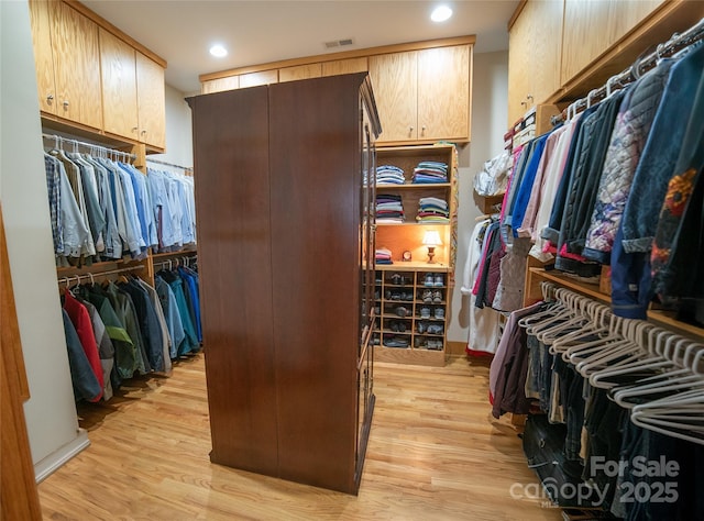 walk in closet with visible vents and light wood-style flooring