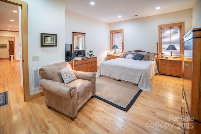 bedroom featuring light wood-style flooring, recessed lighting, and visible vents