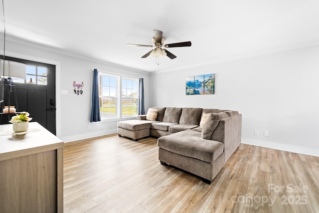 2318 Knight Dr, Gastonia, NC 28052 - living area with baseboards, light wood-style floors, ornamental molding, and a ceiling fan