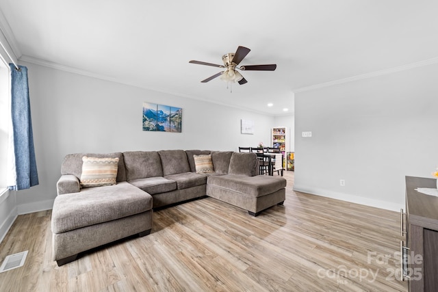 2318 Knight Dr, Gastonia, NC 28052 - living area featuring a ceiling fan, wood finished floors, crown molding, and visible vents