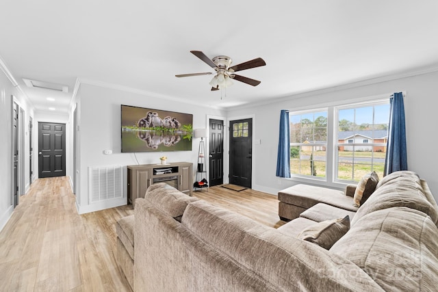 2318 Knight Dr, Gastonia, NC 28052 - living area featuring crown molding, attic access, light wood-type flooring, visible vents, and a ceiling fan