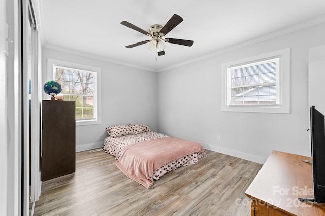 2318 Knight Dr, Gastonia, NC 28052 - bedroom with baseboards, crown molding, light wood-style flooring, and a ceiling fan