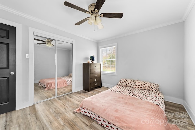 2318 Knight Dr, Gastonia, NC 28052 - bedroom with baseboards, a closet, crown molding, and wood finished floors