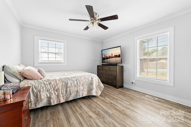 2318 Knight Dr, Gastonia, NC 28052 - bedroom featuring visible vents, crown molding, baseboards, wood finished floors, and a ceiling fan