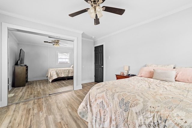 2318 Knight Dr, Gastonia, NC 28052 - bedroom featuring a closet, baseboards, ornamental molding, wood finished floors, and ceiling fan