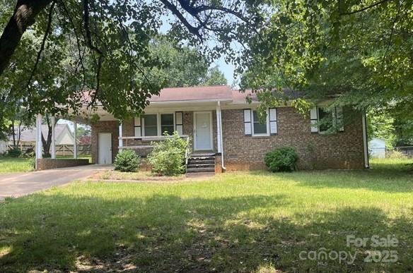 1327 Crestview Dr, Shelby, NC 28150 - ranch-style home with a front lawn, brick siding, and driveway