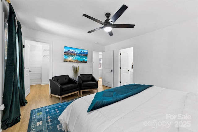 bedroom with ceiling fan and light wood-style flooring