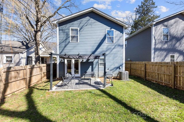 back of property featuring a patio, a yard, a fenced backyard, a pergola, and central AC