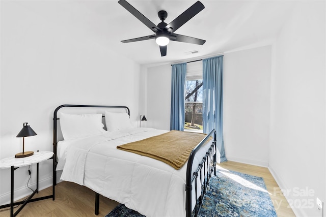 4114 Rutgers Ave, Charlotte, NC 28206 - bedroom featuring wood finished floors, baseboards, and ceiling fan