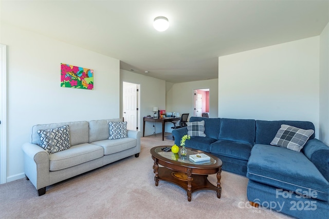 living area featuring carpet