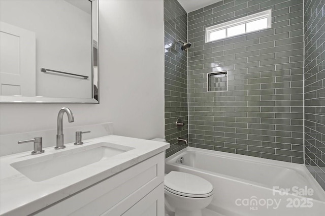 bathroom featuring toilet, vanity, and washtub / shower combination