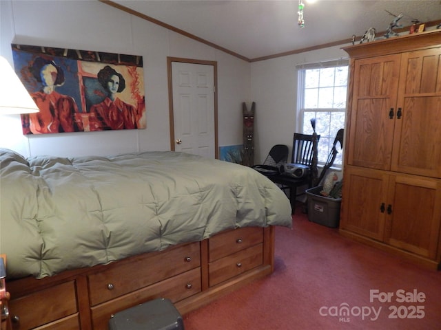 carpeted bedroom featuring ornamental molding and vaulted ceiling