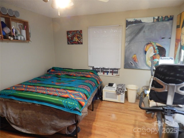 bedroom with wood finished floors