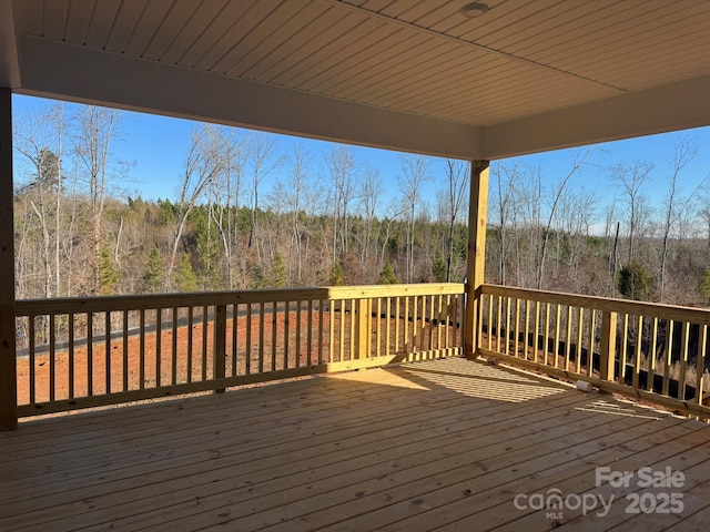 deck featuring a view of trees