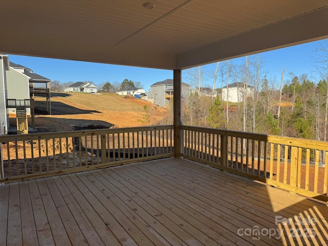 wooden deck with a residential view