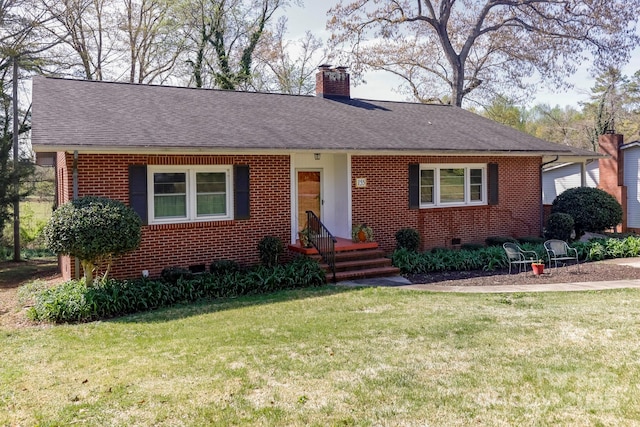 view of front of property featuring crawl space, a front yard, and brick siding