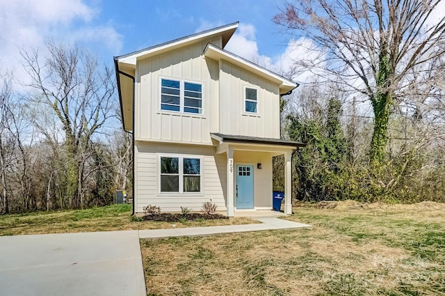 view of front of property featuring a front lawn and board and batten siding