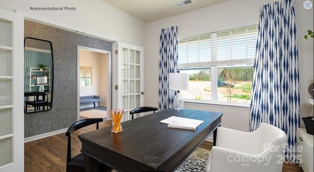 home office featuring visible vents, baseboards, and wood finished floors