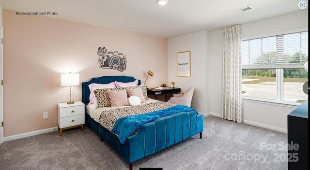 bedroom with baseboards, visible vents, and carpet floors