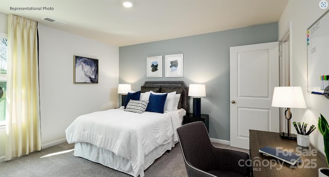 bedroom featuring visible vents, baseboards, and carpet flooring