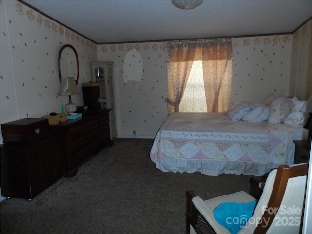 bedroom with ornamental molding, wallpapered walls, and carpet floors