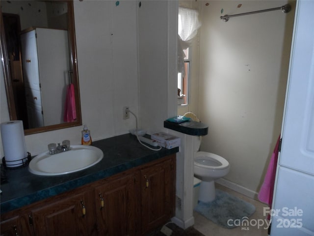 bathroom with vanity and toilet