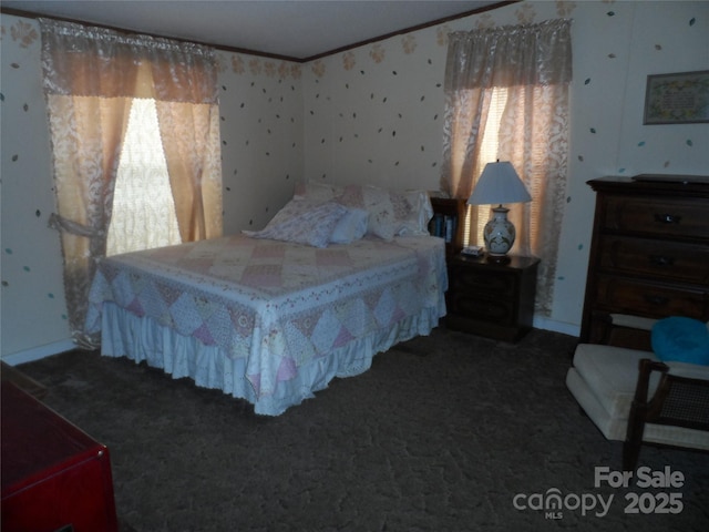 bedroom featuring wallpapered walls, carpet flooring, and crown molding