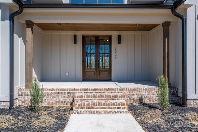 entrance to property with board and batten siding and french doors