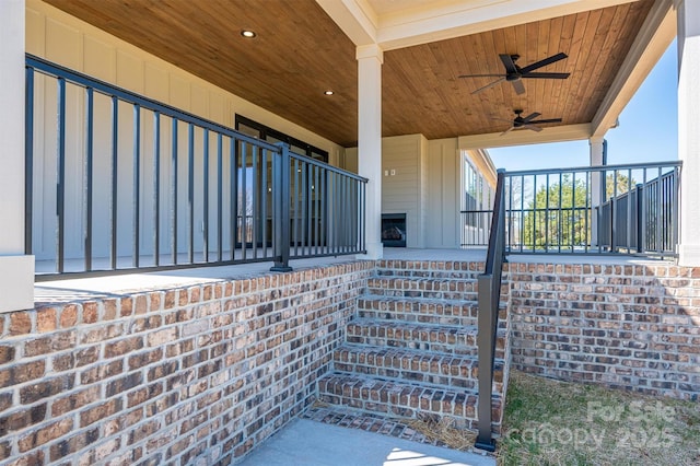 view of patio featuring stairway and a ceiling fan