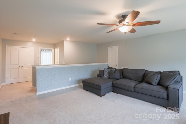 living room with light carpet, recessed lighting, baseboards, and ceiling fan